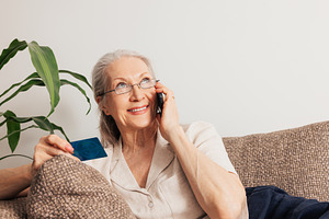 Smiling senior woman ordering, a Person Photo by Artem Varnitsin