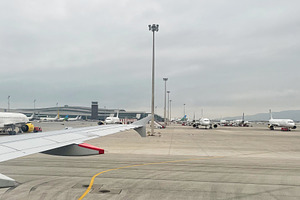 Aircraft parked on a cloudy day in airport runway in Spain, a Photo by AS photostudio