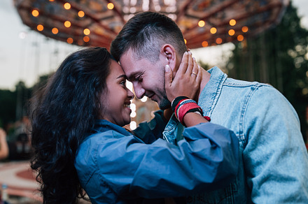 Smiling couple embracing at night, a Person Photo by Artem Varnitsin