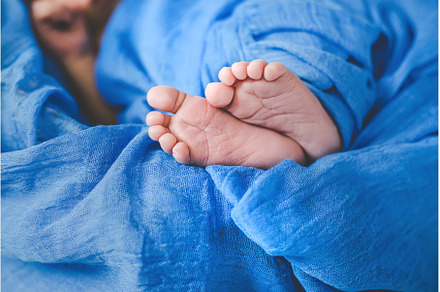 Newborn baby sleeping on a blue, a Person Photo by yanadjana