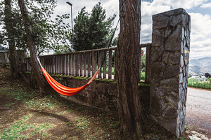 Orange hammock by stone wall, a Sports & Recreation Photo by SkyNext
