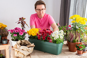 A 50-year-old woman transplanting, a Nature Photo by Pundateam