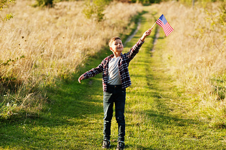 Little boy with USA flag outdoor. America celebrating., a Person Photo by AS photostudio