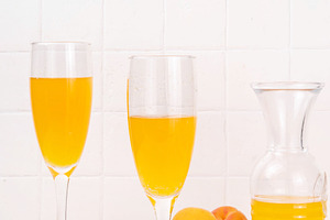 Summer sweet and tasty apricot bellini sparkling cocktail, a Food & Drink Photo by Rimma