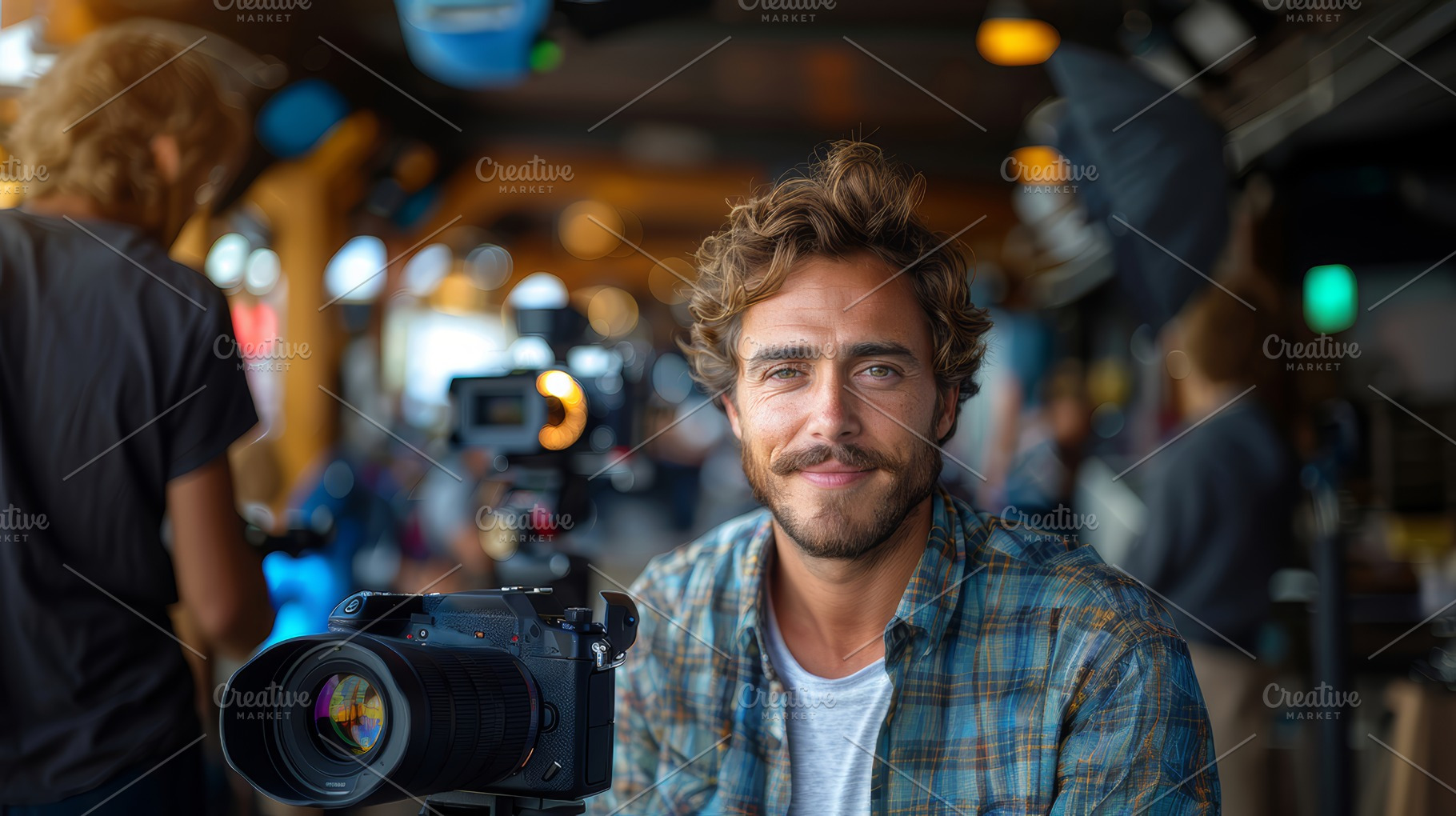 Young Man Smiling and Focusing with Digital Camera in a Busy Studio Environment, a Photo by AS photostudio