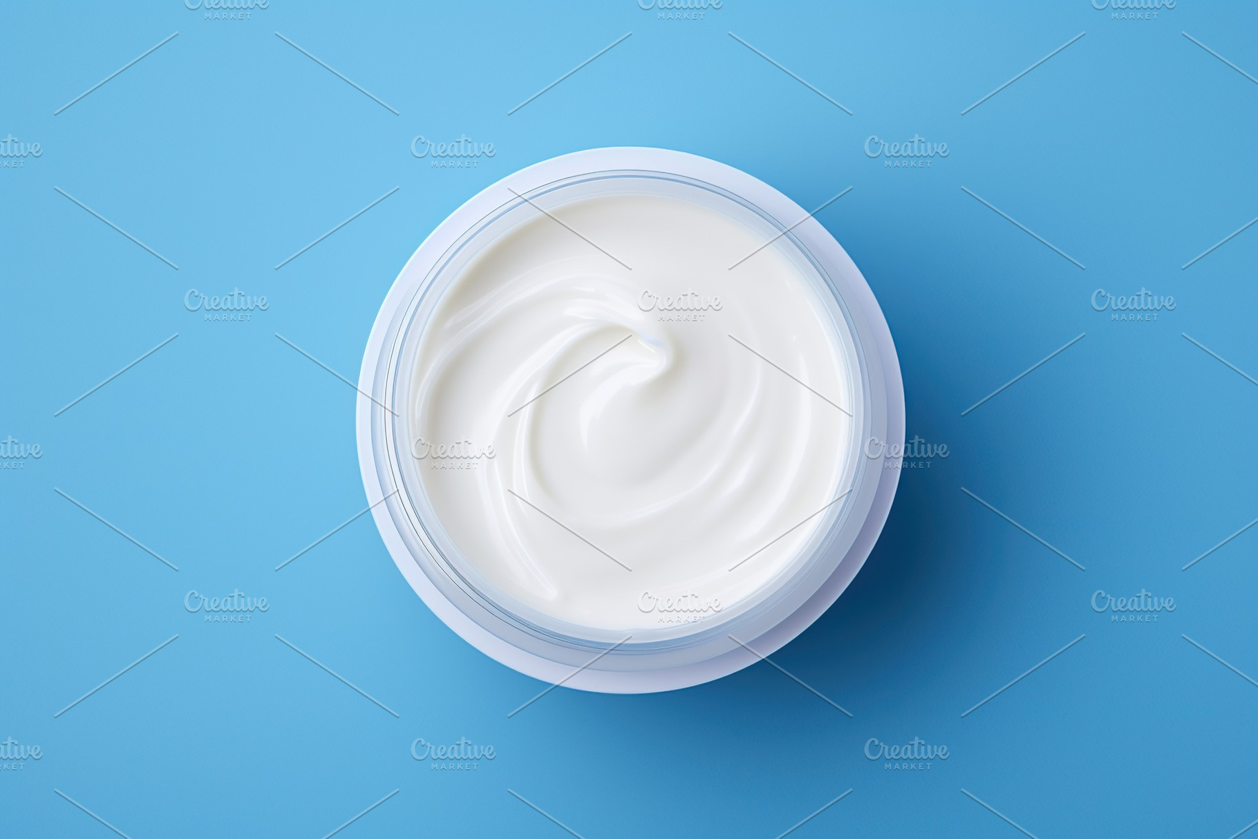 White plastic bowl of hand cream on blue background, a Beauty & Fashion Photo by AlyaAnd
