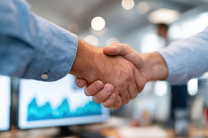 Handshake signifies collaboration between startup CEO and investor in modern of, a Photo by AlyaAnd