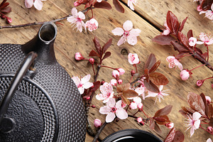 Japanese Teapot and Cups with Cherry Blossoms on Wooden Table, a Holiday Photo by Natalia Klenova's Shop