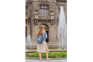 Young woman tourist standing near, an Architecture Photo by Elizaveta Galitskaya