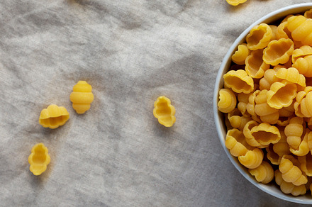 Dry Organic Gnocchi Pasta in a Bowl, top view. Flat lay, overhea, a Food & Drink Photo by LiudmylaChuhunova