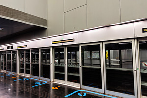 Empty metro platform with glass safety doors at a modern undergr, a Photo by AS photostudio