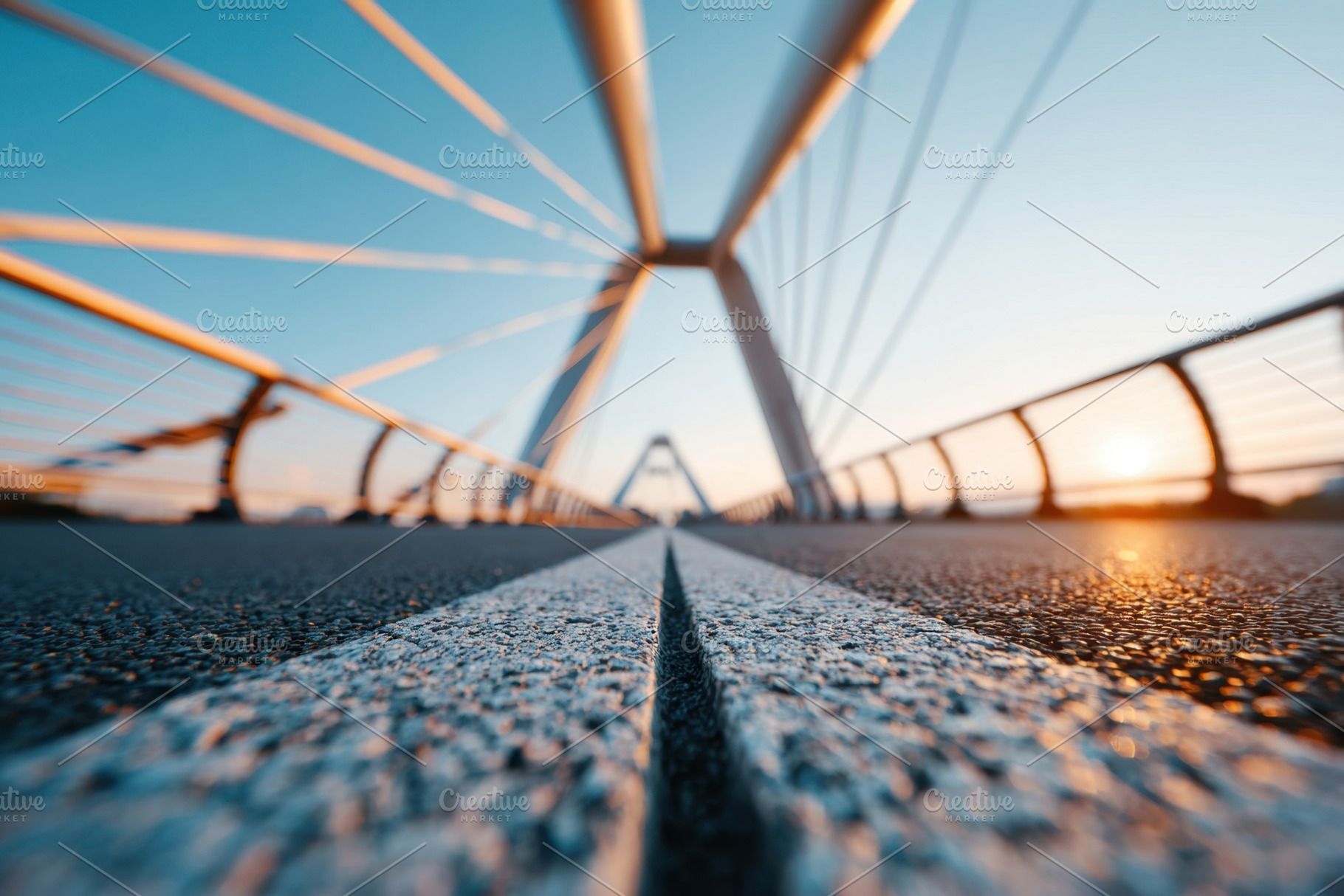 Modern pedestrian bridge at sunrise, an Architecture Photo by AlyaAnd