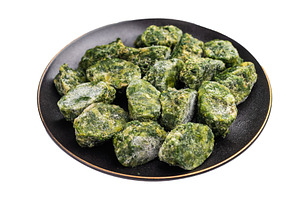 Green, icy spinach portions ready for cooking, served in a rusti, a Food & Drink Photo by composter-box@mail.ru
