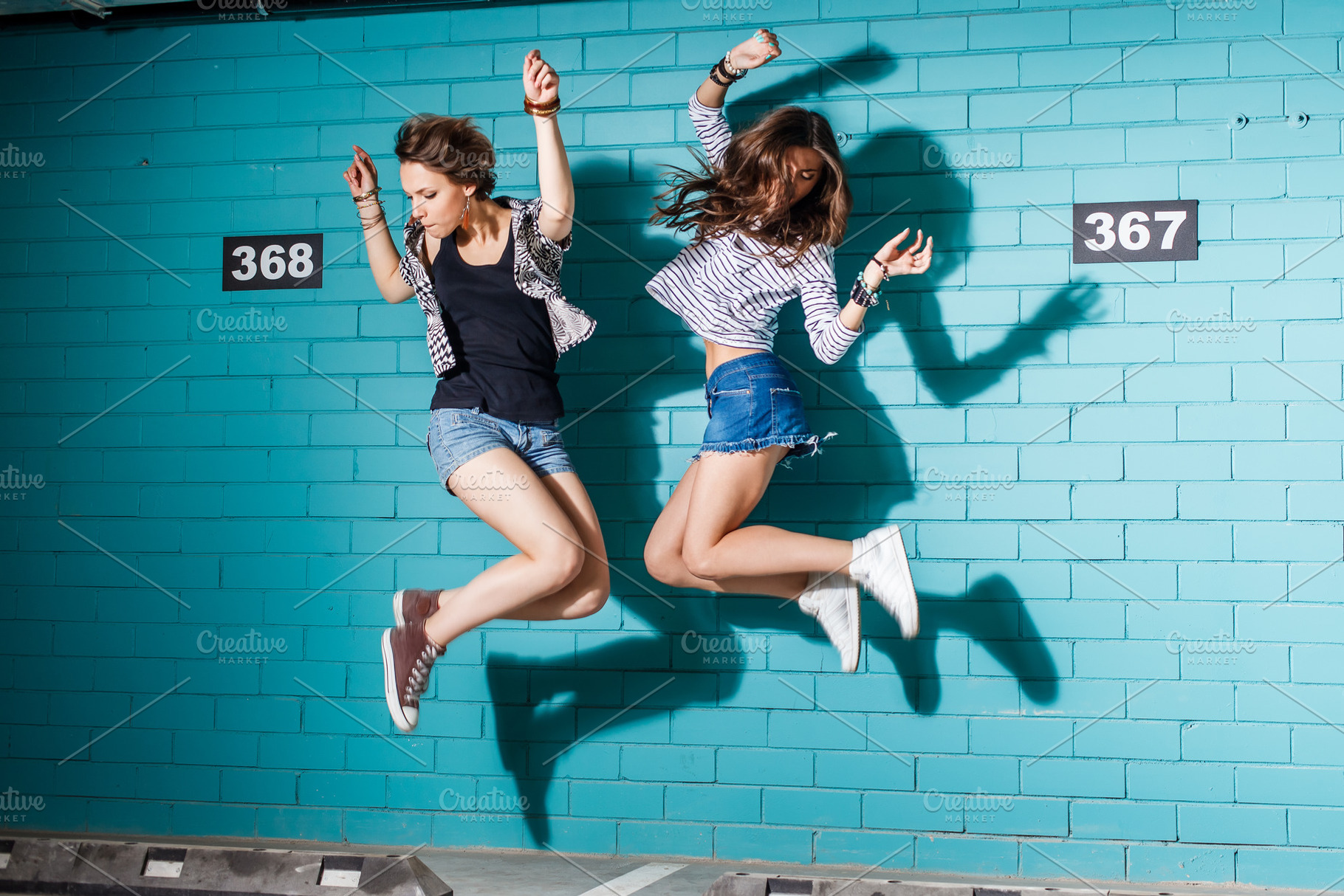 Happy young people having fun and ju stock photo containing bff and adult, an Arts & Entertainment Photo by Mikalai