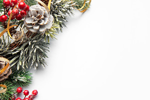 Christmas winter decoration with pinecones and berries creating, a Holiday Photo by Olena Rudo