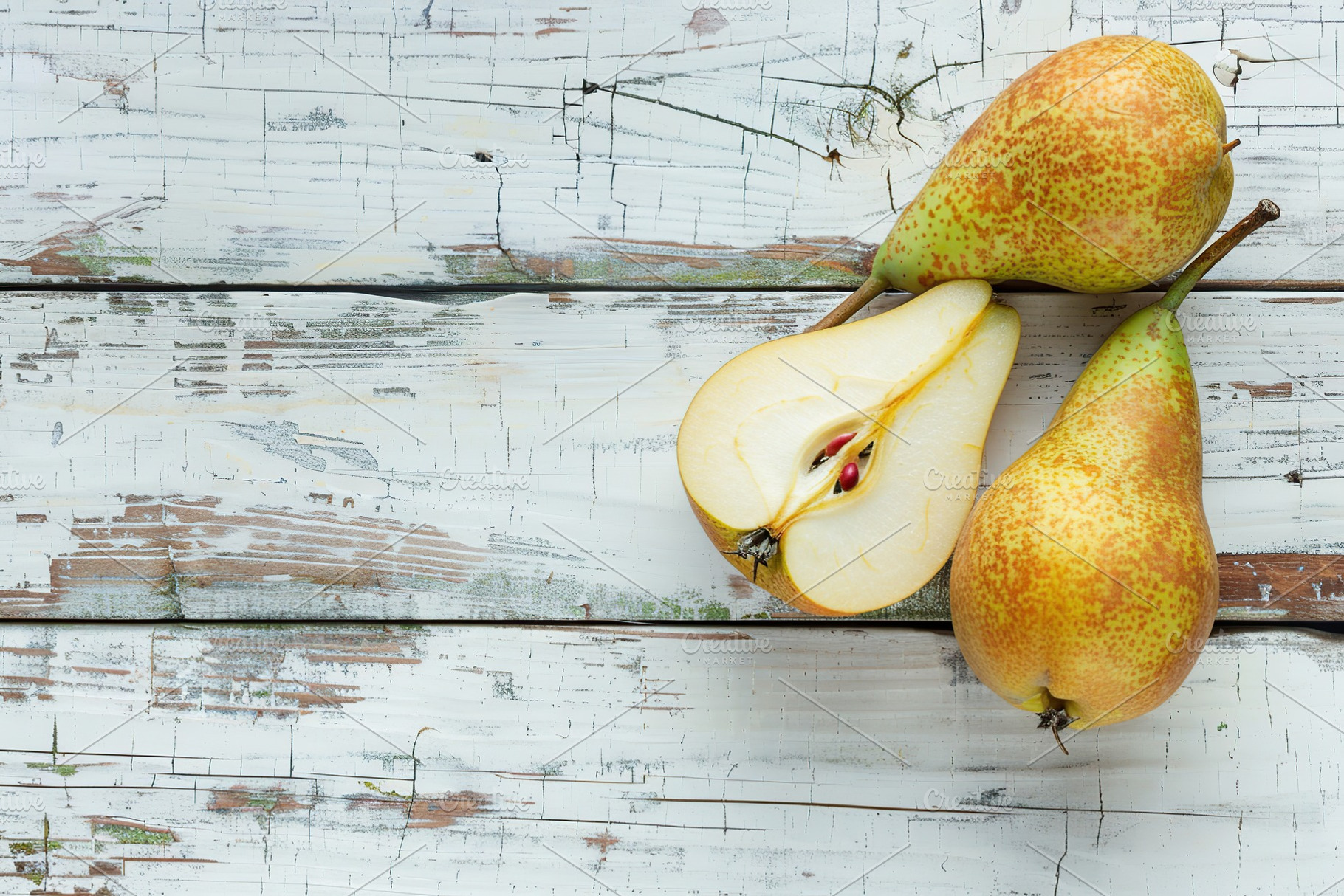 Yellow ripe pears on white wooden table, a Food & Drink Photo by AlyaAnd