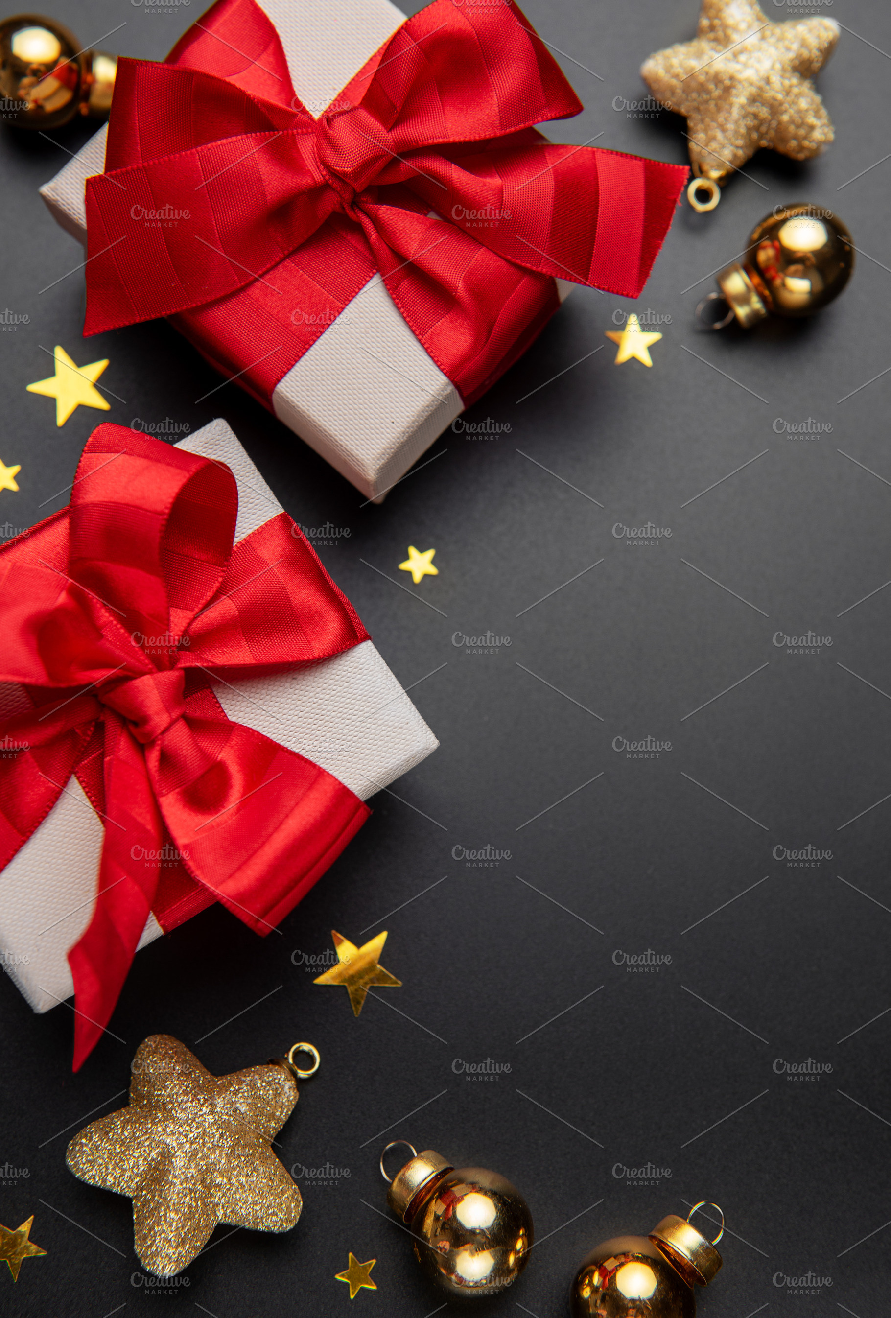 Christmas gifts decorating a dark background with stars, a Holiday Photo by Olena Rudo