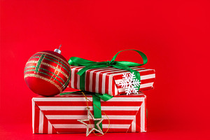 Bright high-colored background with Christmas boxes, festive bau