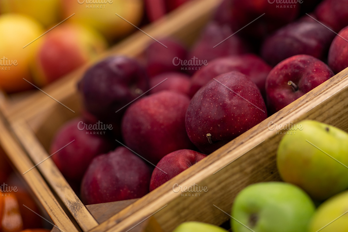 Vitrine with different types of apples exhibited at supermarket, a Photo by Prostock-Studio (Photo 1 of 2)