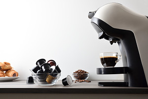 Freshly brewed coffee in an espresso machine on wooden bench, a Food & Drink Photo by Davizro's Market