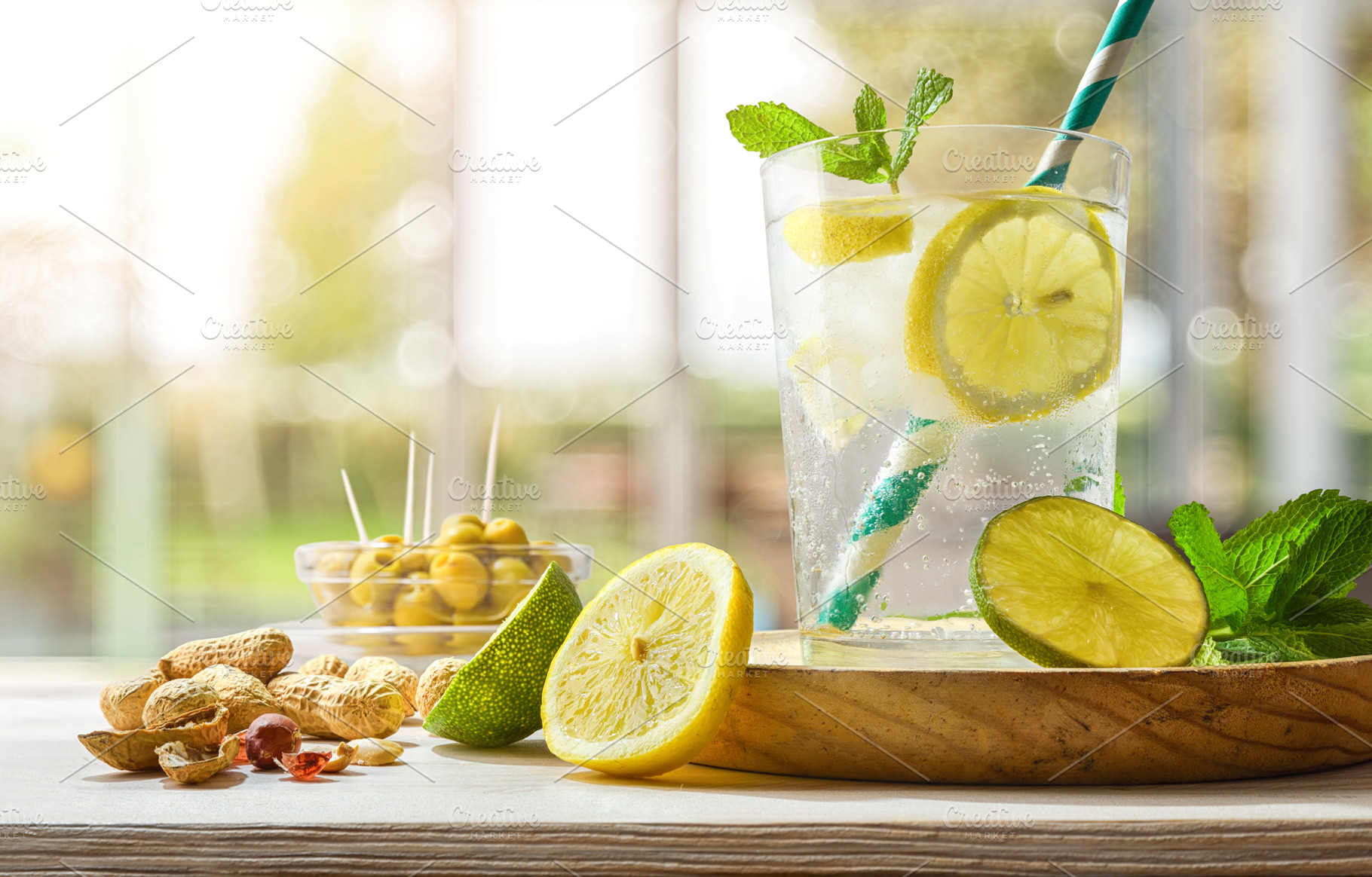 Refreshing carbonated lemon drink on a table on a terrace, a Food & Drink Photo by Davizro's Market