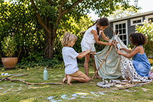 Children building backyard stick ten, a Photo by Dvoevnore photos