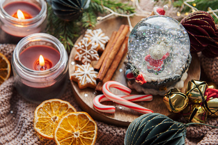 A snow globe and christmas candles with branches of fir., a Holiday Photo by Olena Rudo