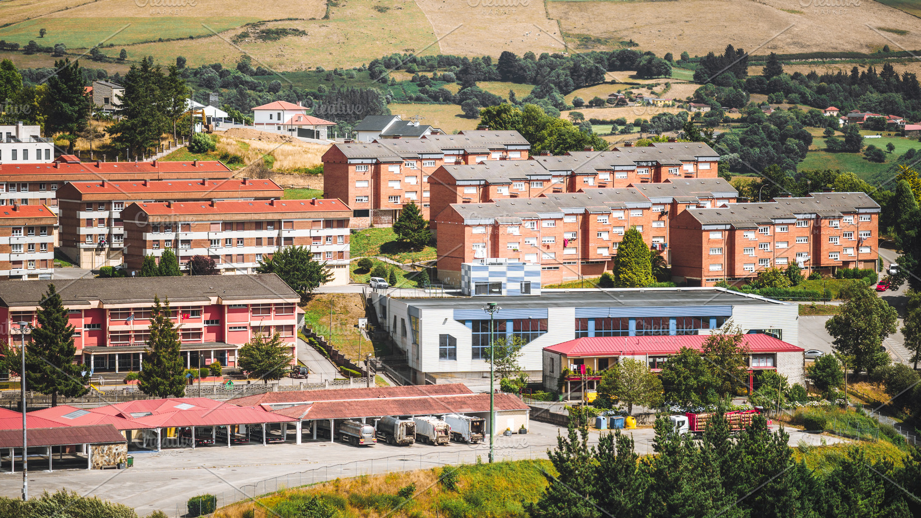 Tineo residential area with parking, an Architecture Photo by SkyNext