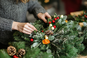 A florist is carefully arranging, a Photo by Pavel_design