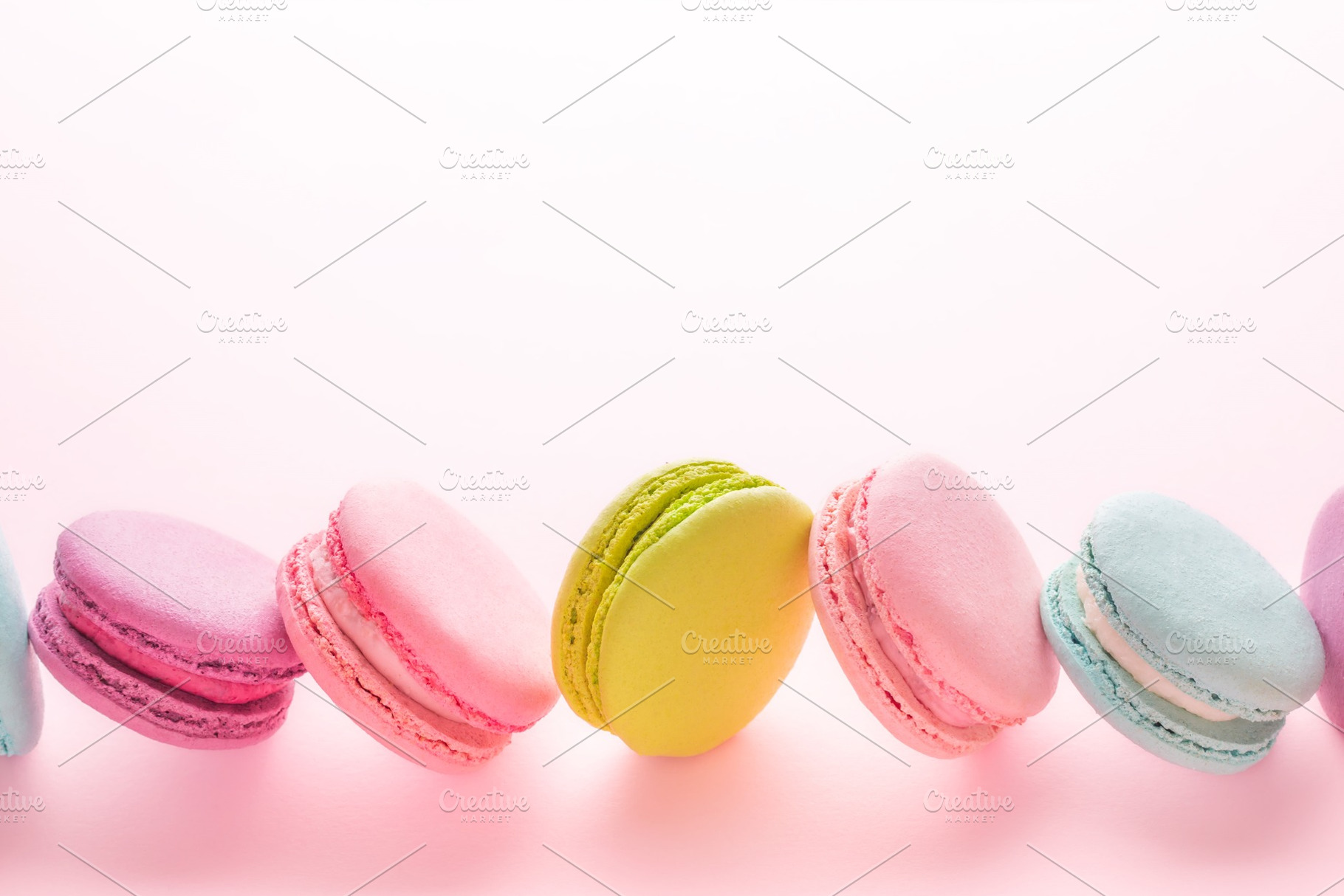 The row of colorful macarons stock photo containing macaron and pink, a Food & Drink Photo by Olga_Z