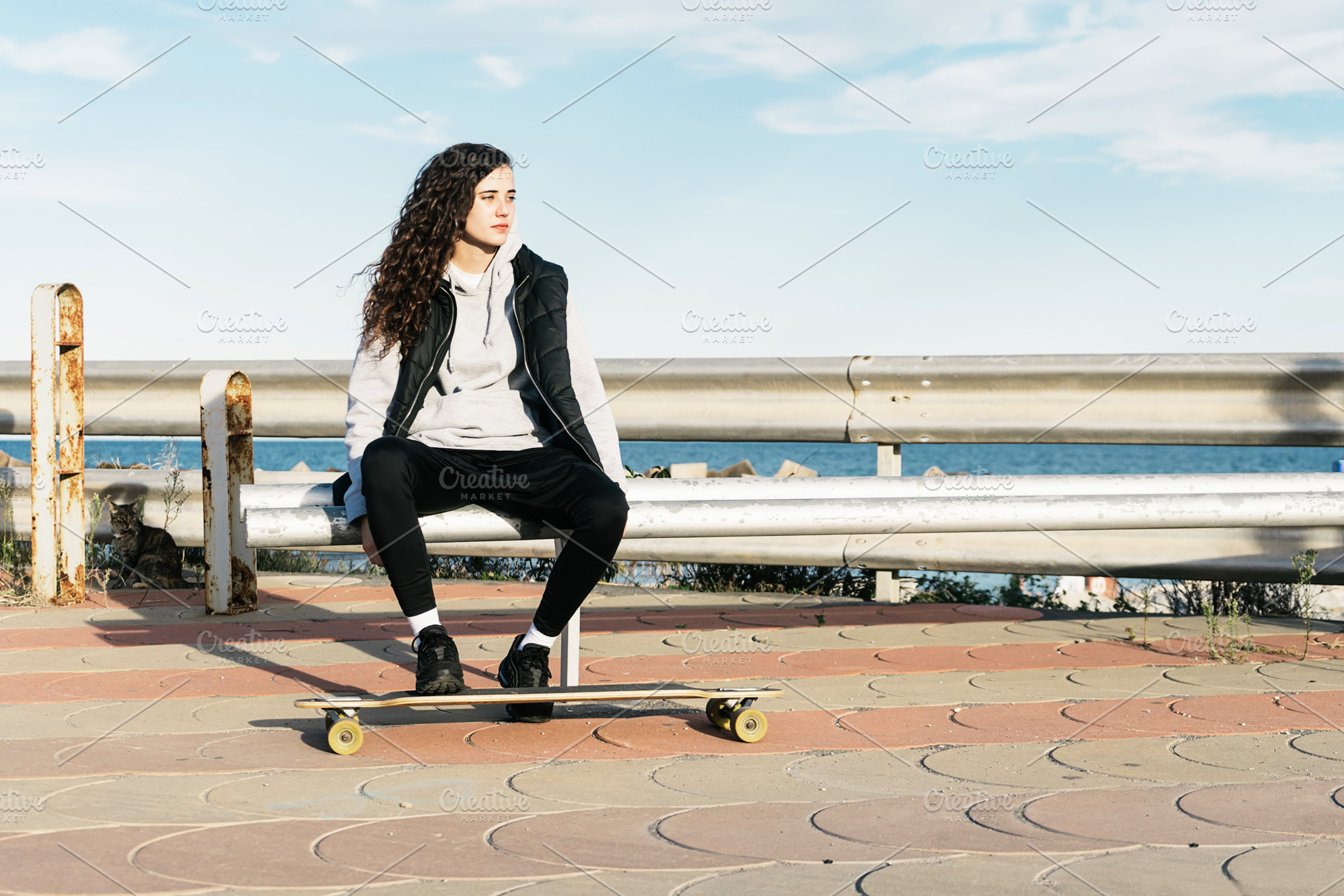 Teenage girl sitting on a bench with stock photo containing female and woman, a Person Photo by 2Design