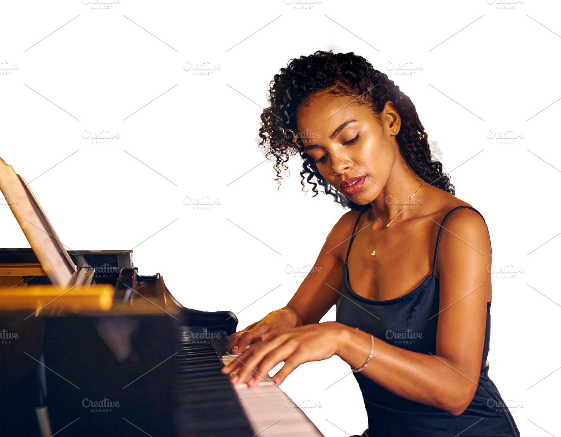 Isolated image of adult woman pianist performing at the piano, an Arts & Entertainment Photo by DanFLCreativo