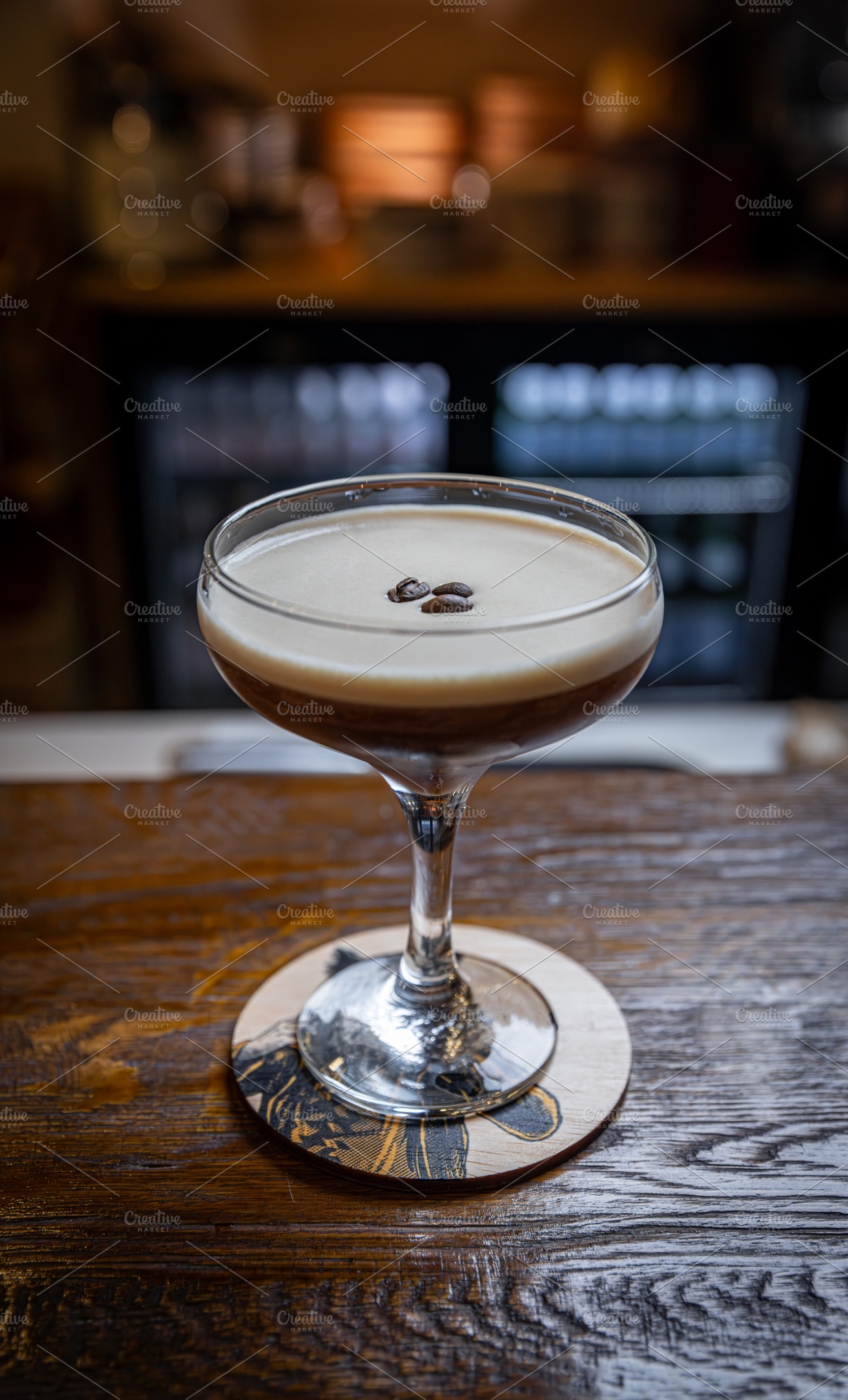 Espresso martini with a creamy foam layer, a Photo by Grafvision photography