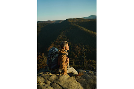 Tired and inspired hiker man sitting, a Nature Photo by vitaliymateha photography