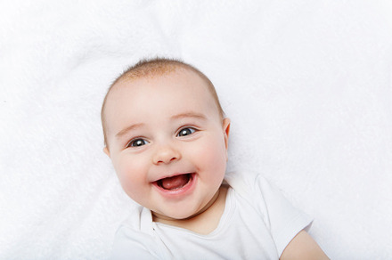 Happy beautiful baby boy in white featuring infant, isolated, and cute