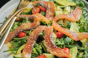 Salad with salted salmon and arugula, a Food & Drink Photo by Budarinphoto