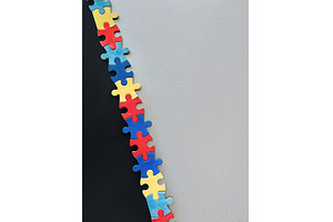 Colorful interlocking puzzle pieces, a Photo by tilialucida