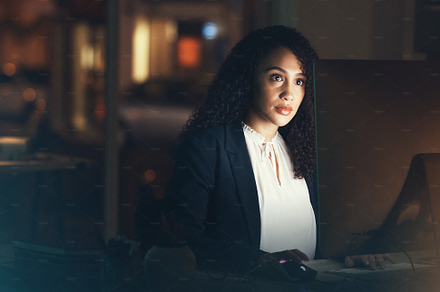 Office, night and black woman on computer for business project, management report and online document. Corporate manager, overtime and female worker working on strategy, planning and website research, a Photo by Peopleimages.com