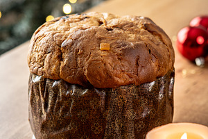 Traditional Italian panettone on wooden table with Christmas decorations, a Food & Drink Photo by etorres69