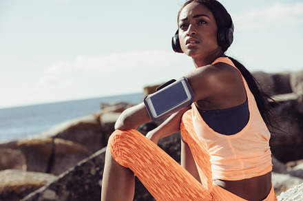 Woman runner sitting at seaside, a Sports & Recreation Photo by Jacob Lund
