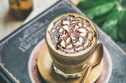 Latte coffee with chocolate sauce stock photo containing cappuccino and latte, a Food & Drink Photo by Foxys