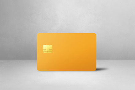 Yellow credit card on a white concrete background, a Business Photo by GoodGoods