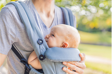 Young father walks in nature with