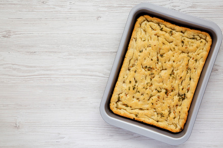 Home-baked Rosemary Garlic Focaccia Bread on baking tray, top vi, a Food & Drink Photo by LiudmylaChuhunova