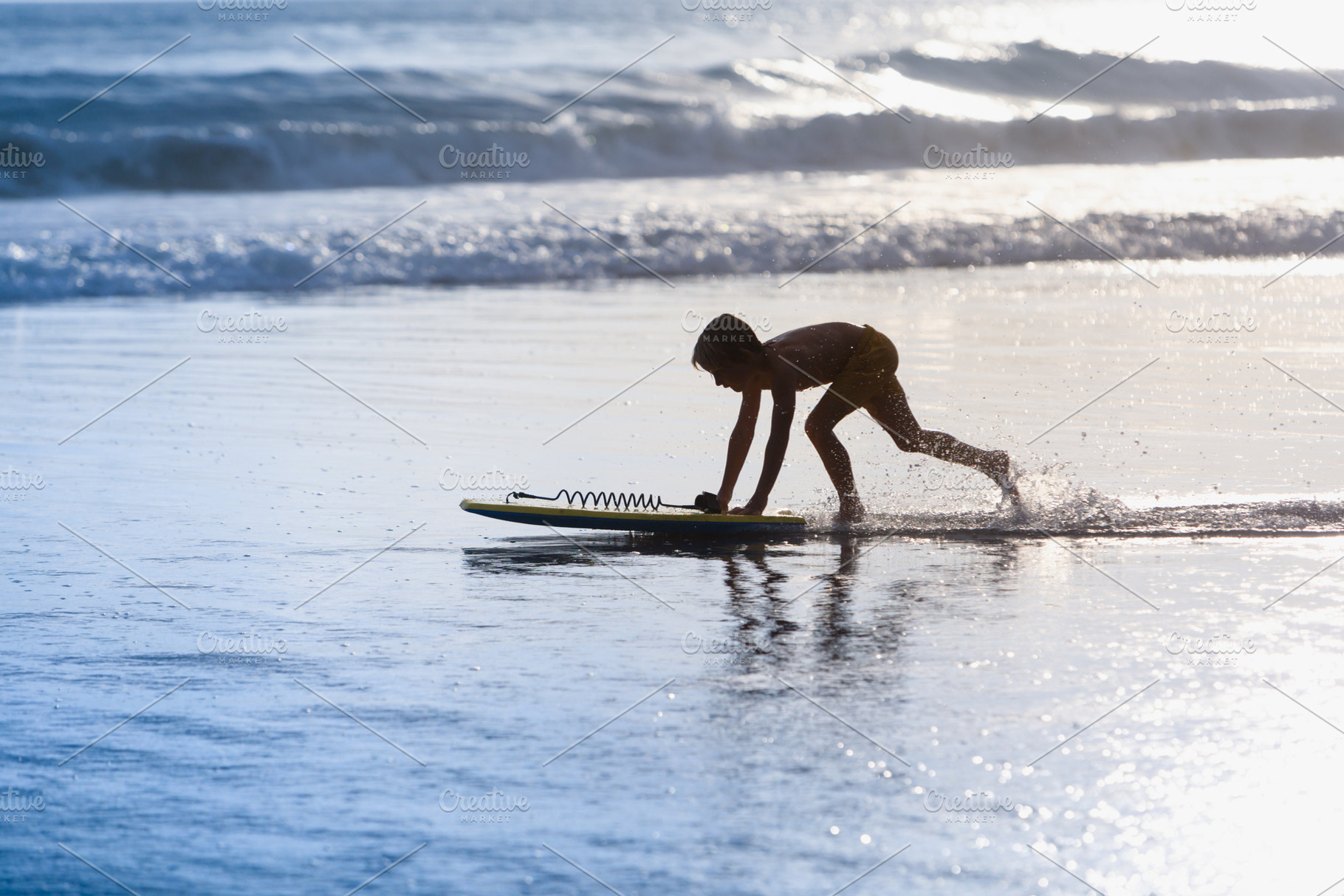 Boy with bodyboard have fun on beach, a Person Photo by Tropical Studio