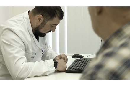 Elderly man at doctor's appointment, a Health & Medical Photo by Media Whale Stock