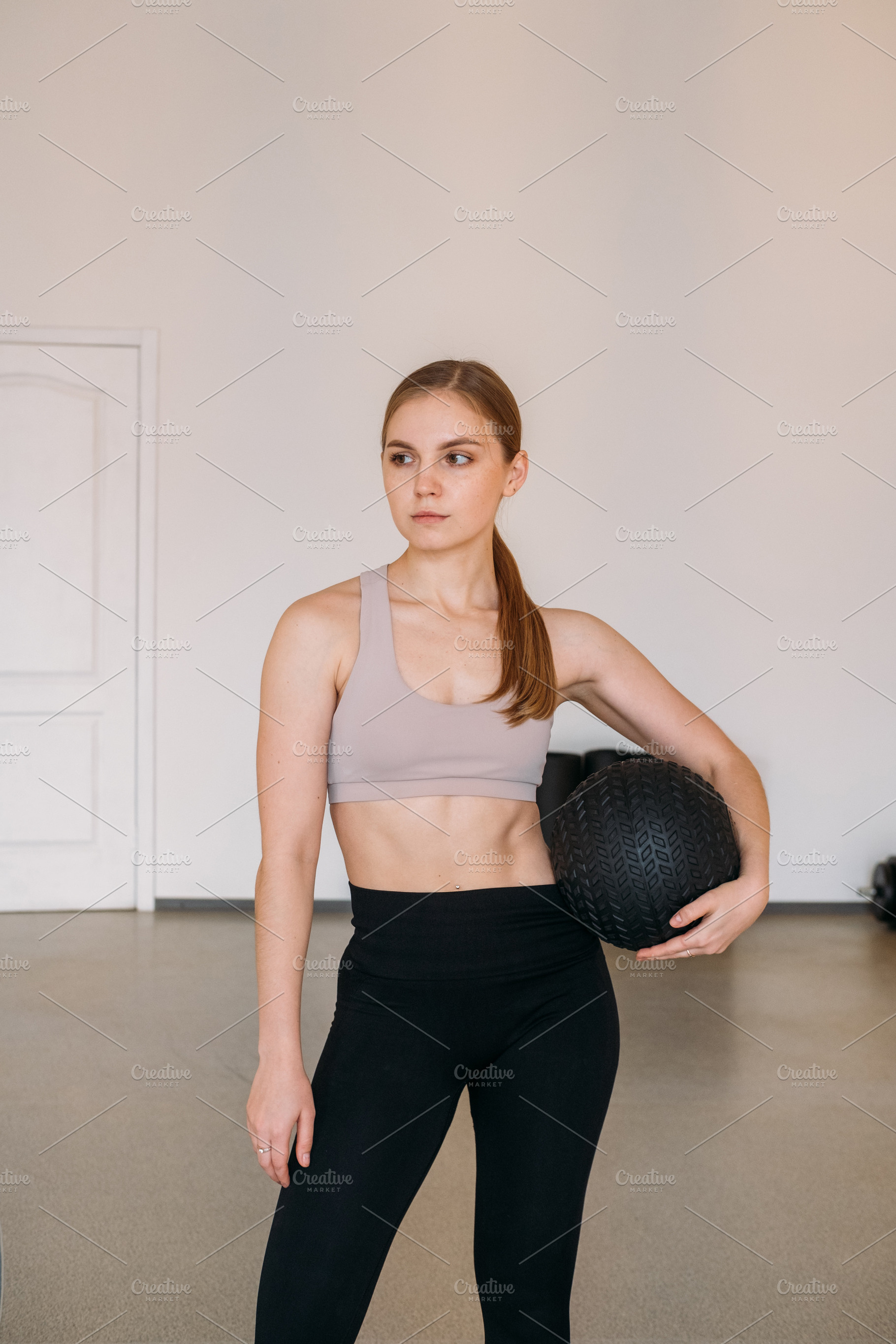 Athletic woman posing healthy lifestyle slam ball, a Person Photo by Photo Drive Studio