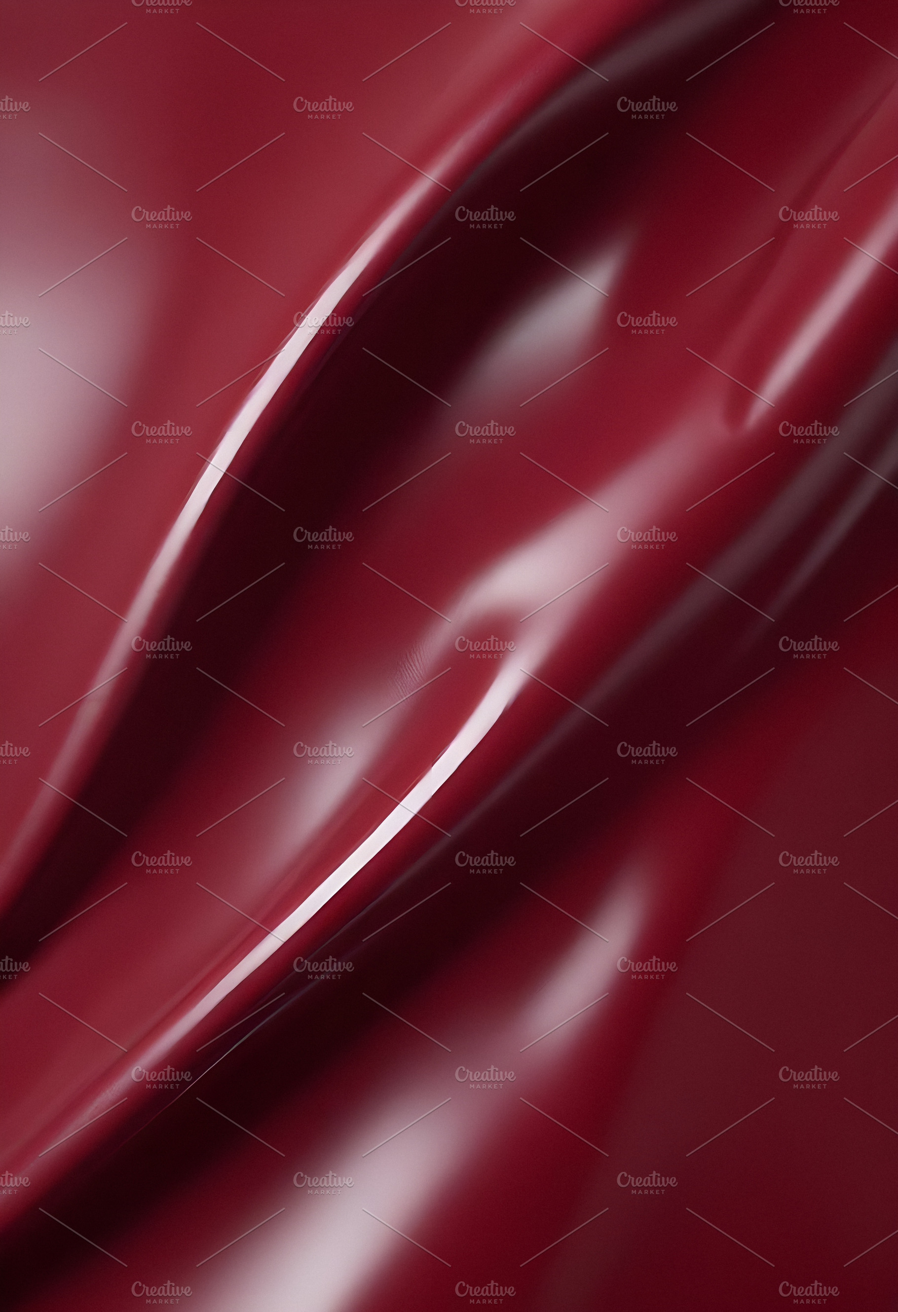 Deep maroon fabric draped elegantly on a surface, showcasing smooth texture and, a Background Photo by Kzara Visual Concepts