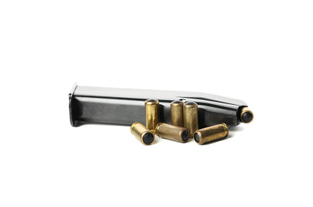 Magazine with bullets and rubber bullets isolated on white backg, an Industrial Photo by AtlasStudio PRO
