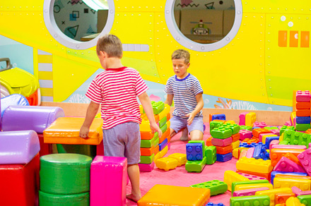 boys playing building toy blocks